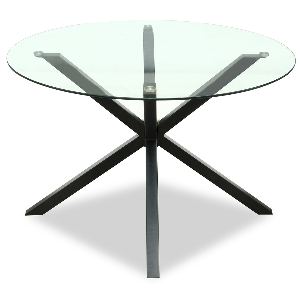 Round glass dining table by Hill Interiors with sleek metal legs, perfect for modern dining rooms.