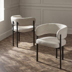 Set of two Julian Bowen Bolivia dining chairs with wooden legs and upholstered seats, shown from a front angle.