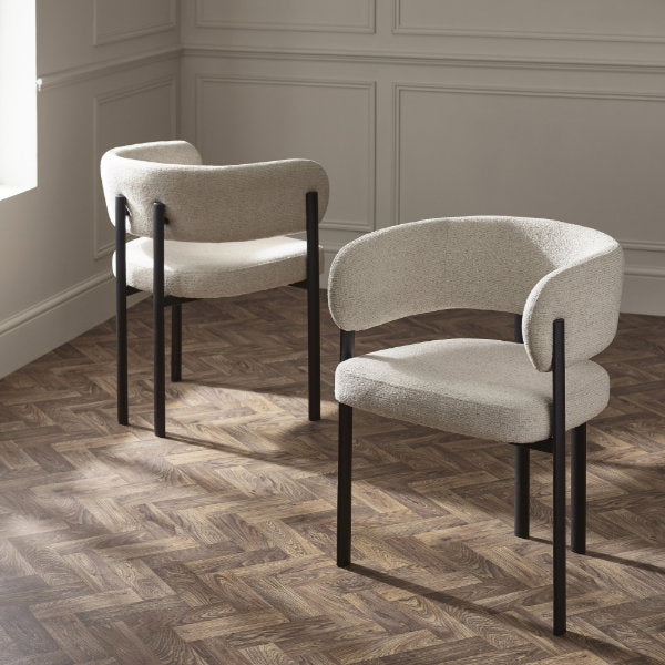 Set of two Julian Bowen Bolivia dining chairs with wooden legs and upholstered seats, shown from a front angle.