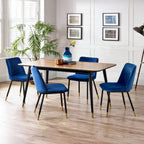 Pair of Julian Bowen Delaunay dining chairs with wooden legs and upholstered seats, shown in a modern dining room setting.
