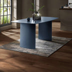 Julian Bowen Element rectangular glass dining table with clear glass top and modern metal legs in a contemporary setting.