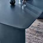 Julian Bowen Element rectangular glass dining table with clear glass top and modern metal legs in a contemporary dining room setting.