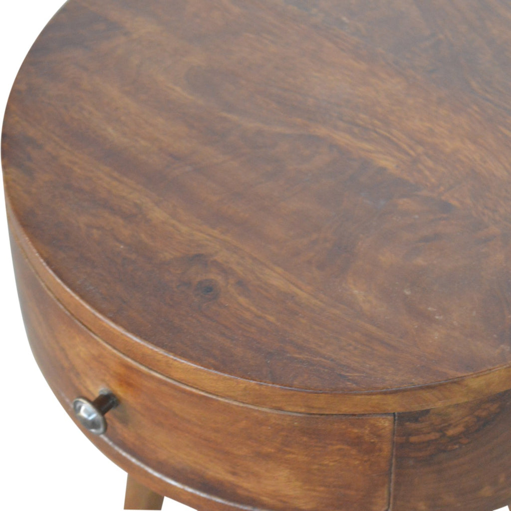 Artisan Nordic Chestnut Circular Bedside Table with wood finish and modern design, featuring a round top and sturdy base.