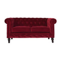 Artisan velvet Chesterfield sofa with tufted upholstery and rolled arms, showcasing elegant, plush seating in a luxurious living room setting.