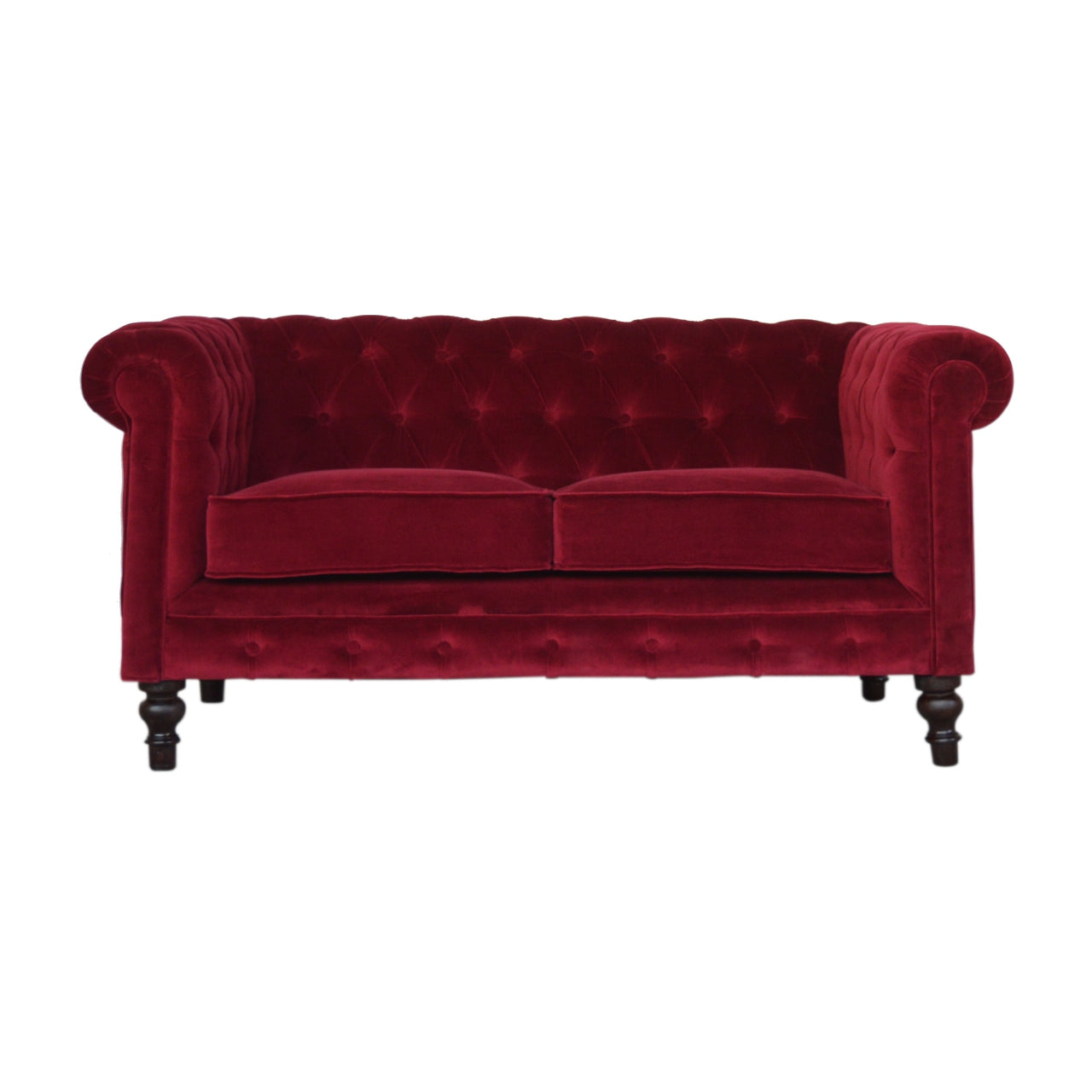 Artisan velvet Chesterfield sofa with tufted upholstery and rolled arms, showcasing elegant, plush seating in a luxurious living room setting.