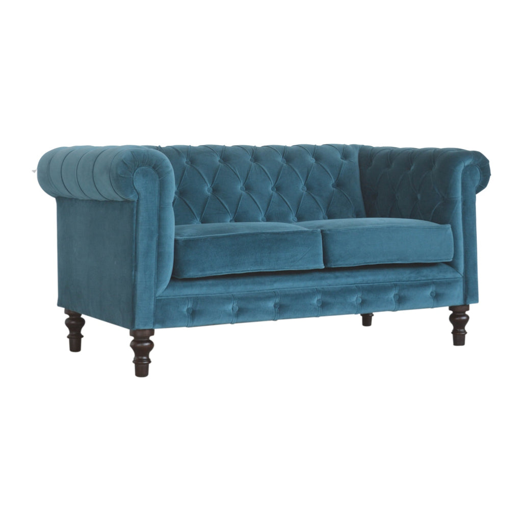 Artisan velvet Chesterfield sofa with tufted upholstery and rolled arms, showcasing luxurious and classic design.