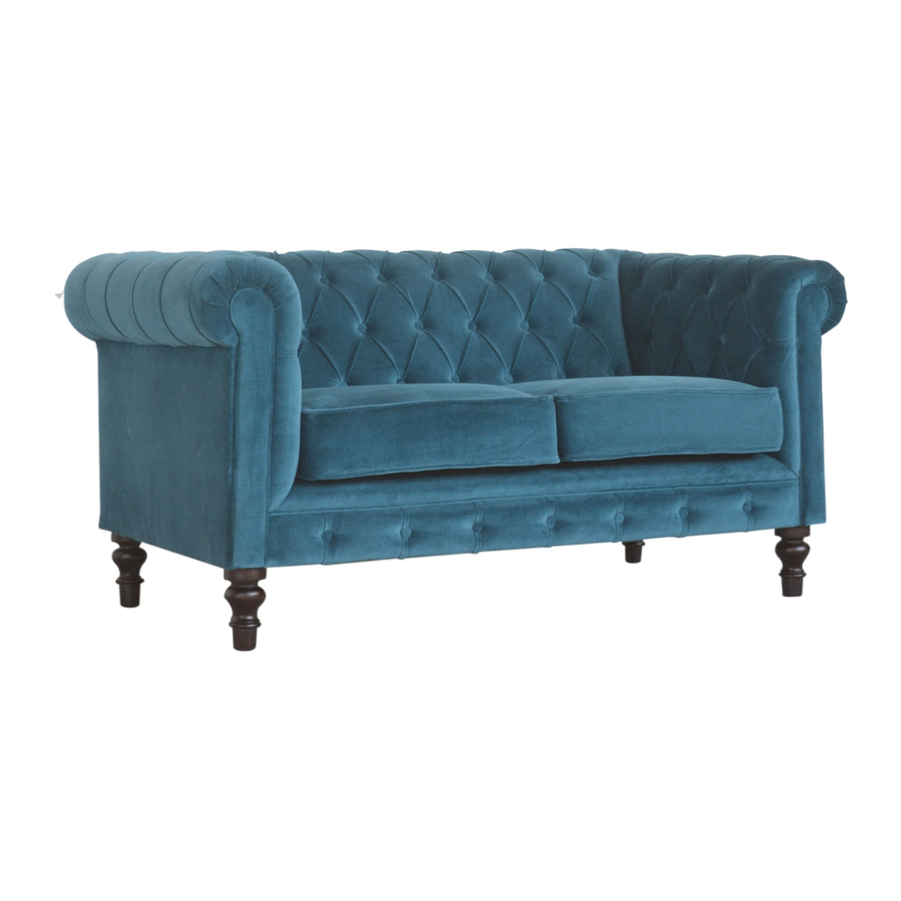 Artisan velvet Chesterfield sofa with tufted upholstery and rolled arms, showcasing luxurious and classic design.