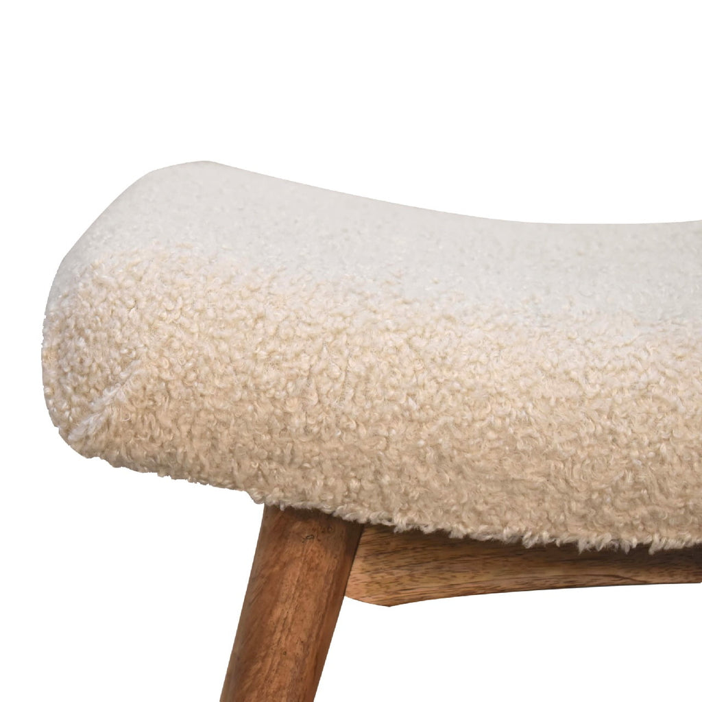 Artisan boucle cream curved bench styled as a stool with plush fabric and sleek design, perfect for modern living spaces.