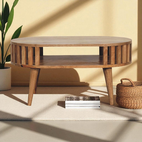 Artisan Ariella coffee table with sleek wooden surface and modern design, placed in a stylish living room setting.