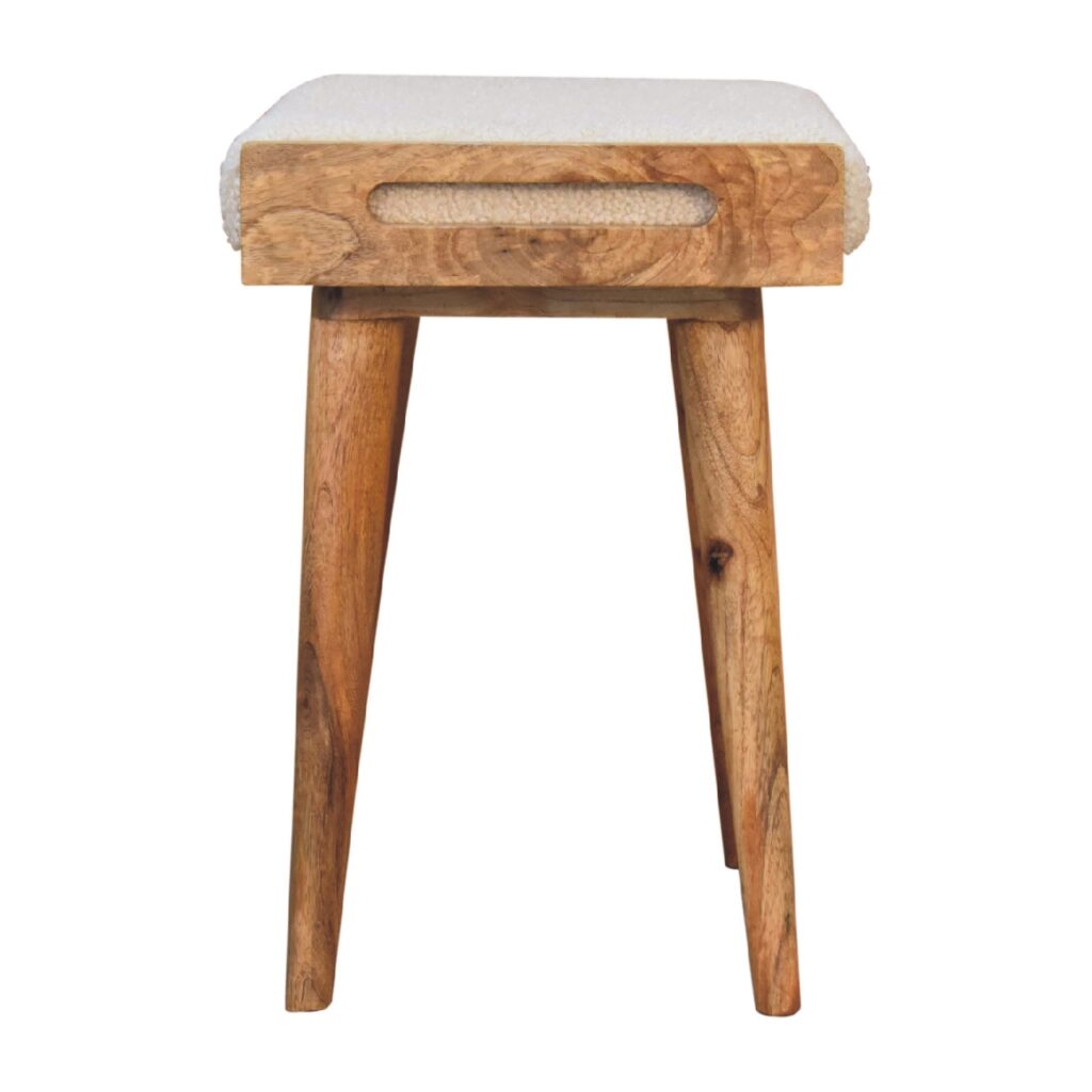 Artisan boucle cream tray-style footstool with upholstered stool design and wooden base, ideal for living room decor.