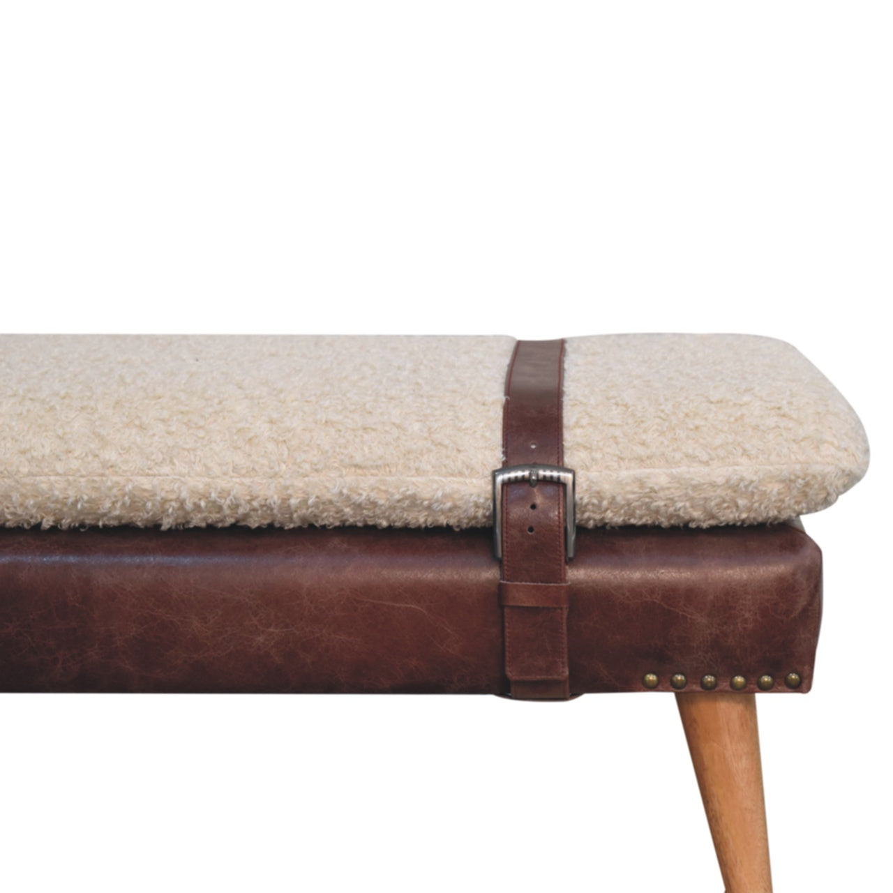 Close-up detail of the mahogany leather harness strap wrapping around the bouclé seat.