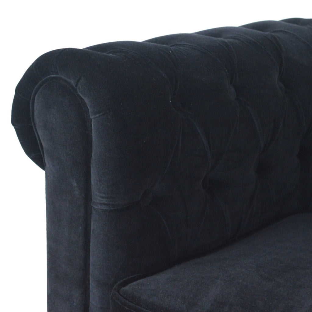 Artisan velvet Chesterfield sofa with deep button-tufted upholstery and rolled arms, showcasing luxurious and elegant design.