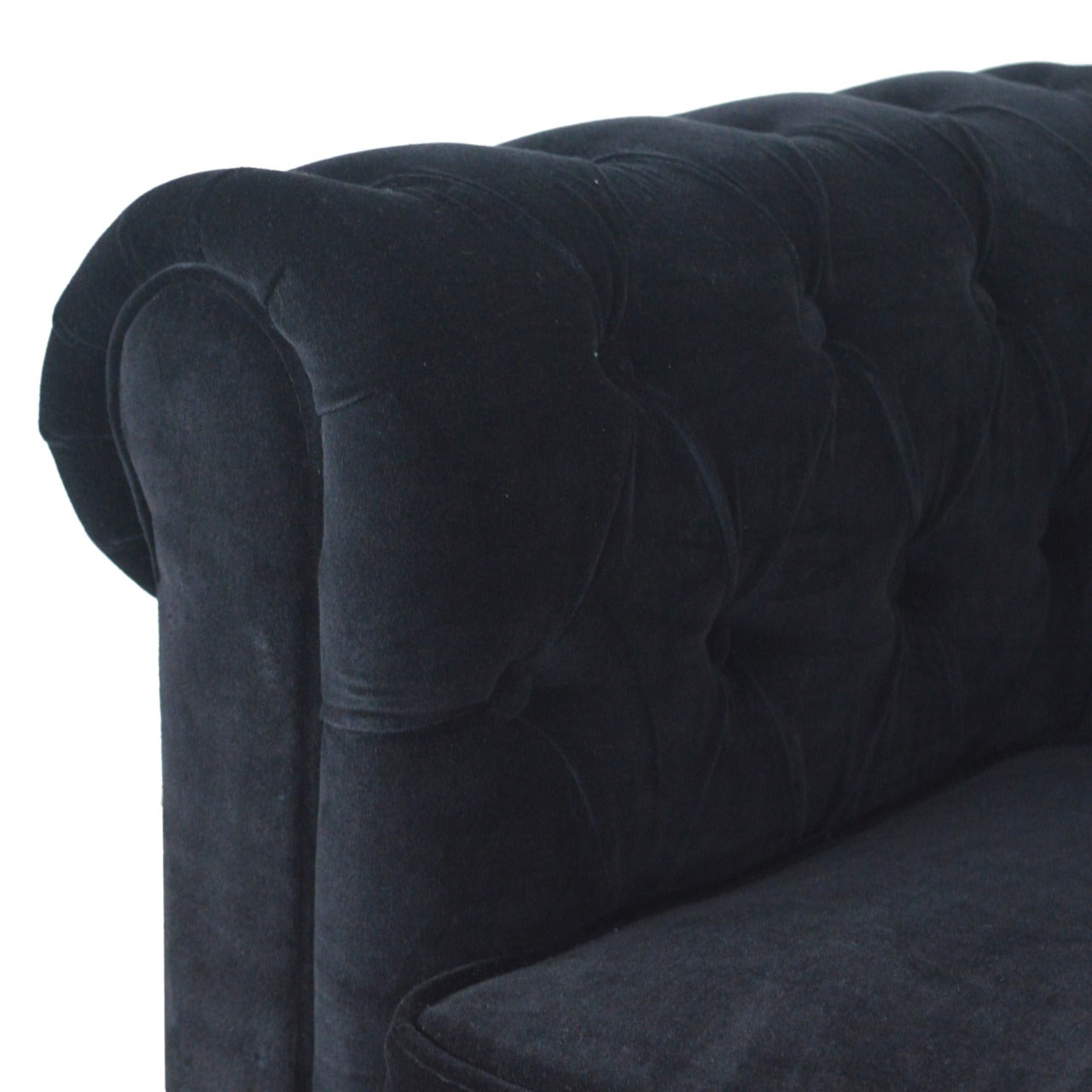 Artisan velvet Chesterfield sofa with deep button-tufted upholstery and rolled arms, showcasing luxurious and elegant design.