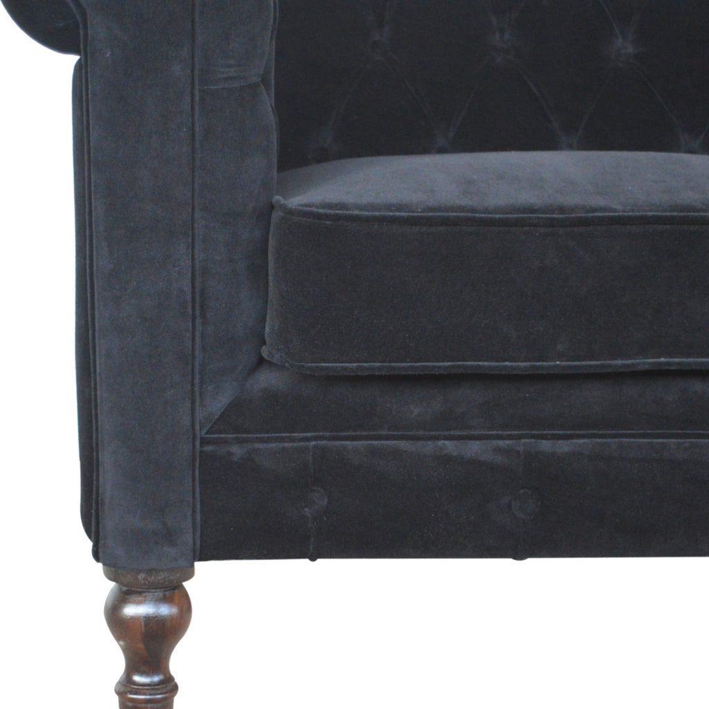 Artisan Velvet Chesterfield Sofa with tufted back and rolled arms, featuring plush upholstery and classic design.