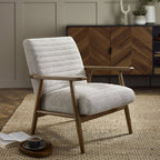 Julian Bowen Ivy armchair with plush upholstery and wooden legs, accent chair with modern design and soft fabric.