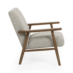 Julian Bowen Ivy Armchair, a stylish accent chair with plush upholstery and wooden legs, displayed in a modern living room setting.