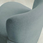 Julian Bowen Lunetta accent chair with beige upholstery and sleek modern design, placed on a wooden floor.