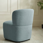 Julian Bowen Lunetta accent chair with a modern design, featuring a beige upholstered seat and wooden legs.