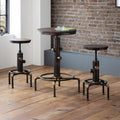Rockport industrial pipework bar table and two matching stools set styled against an exposed brick wall on a dark wood floor