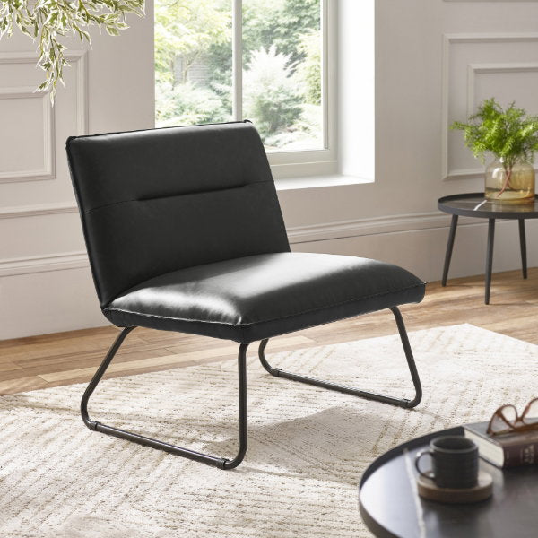 Julian Bowen Saxon Lounge Chair in textured fabric, modern accent chair with cushioned seat and wooden legs.