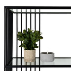 Close-up detail of the durable black metal corner frame joint and clear tempered glass shelf.