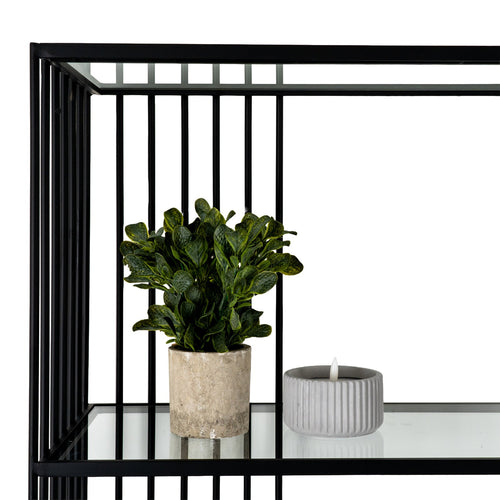 Close-up detail of the durable black metal corner frame joint and clear tempered glass shelf.