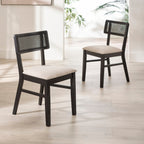 Pair of Annika black rattan back dining chairs shown together in a bright dining room setting