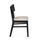 Side profile studio view showcasing the clean lines and backrest pitch of the Annika black dining chair