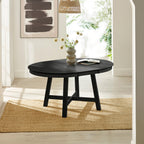 Perspective view of the Annika black dining table fully extended into an oval shape