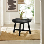 Annika black round extending dining table styled in a modern, bright dining room setting