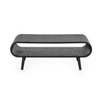 Front view showing the open curved loop shelf and splayed legs of the Apollo black wooden coffee table