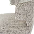 Close-up shot of the curved wing armrest and light grey upholstery on the Avia Mist dining chair