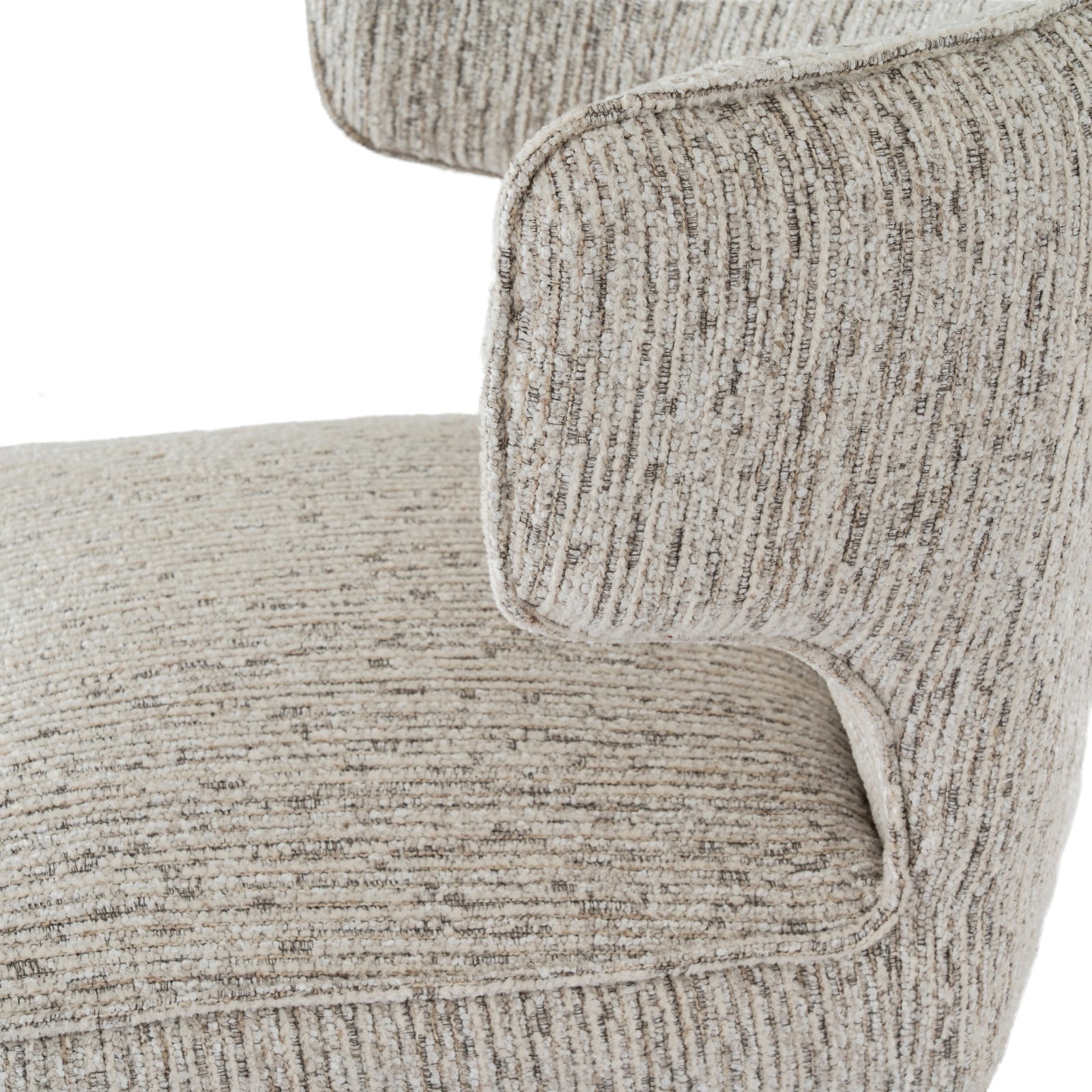 Close-up shot of the curved wing armrest and light grey upholstery on the Avia Mist dining chair