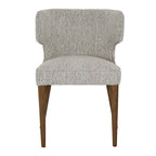 Front view showing the padded seat and warm wooden legs of the Avia Mist grey upholstered dining chair