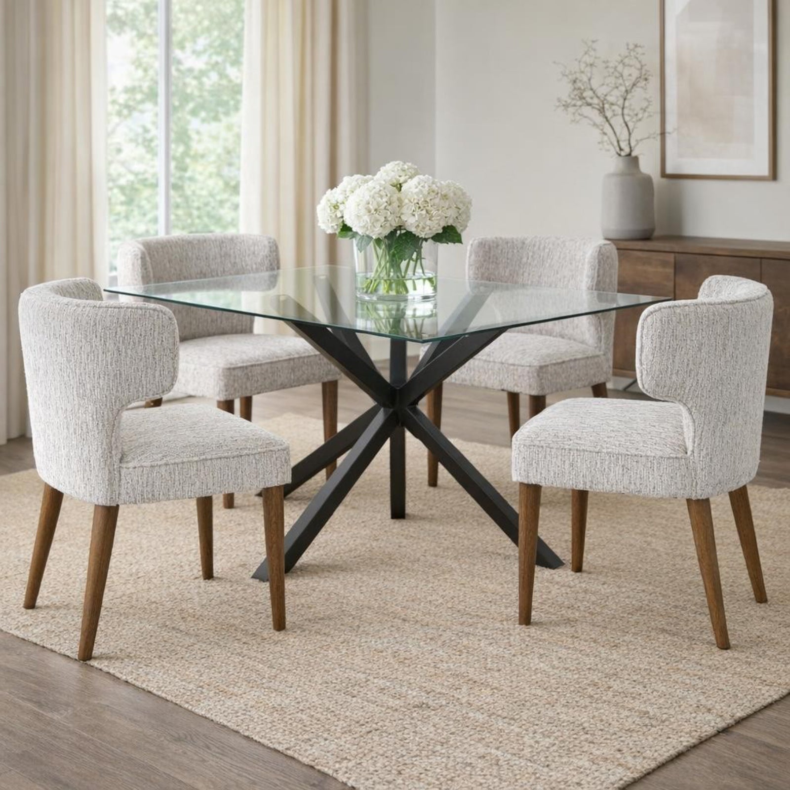 Avia Mist grey textured dining chairs styled around a glass dining table in a bright modern dining room
