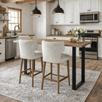 Pair of Avia Mist Upholstered Barstools styled around a bright wooden kitchen island.