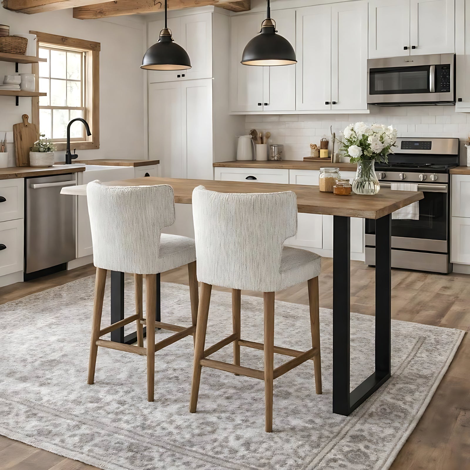 Pair of Avia Mist Upholstered Barstools styled around a bright wooden kitchen island.