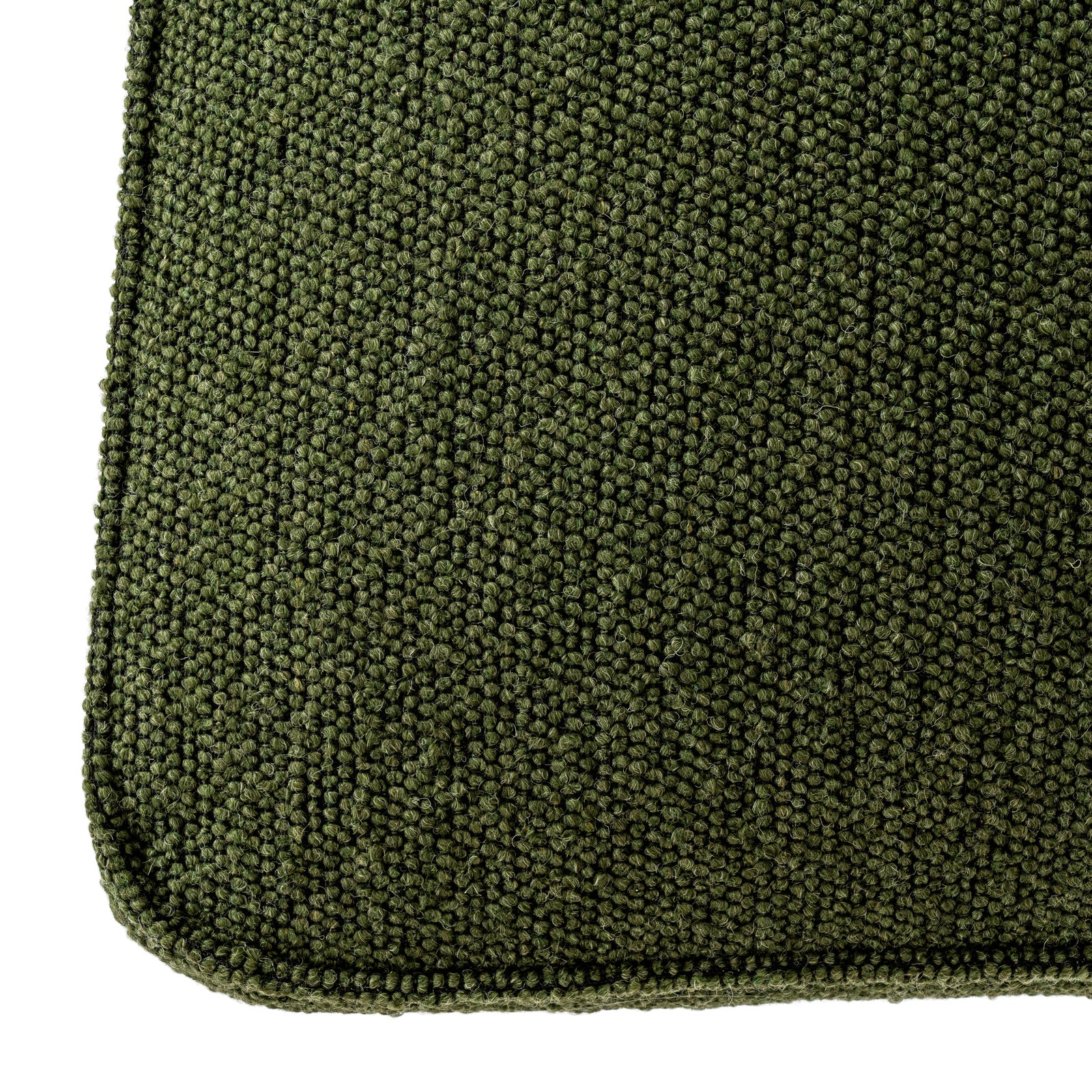 Detailed shot highlighting the rich textured weave of the Moss green fabric on the Avia dining chair