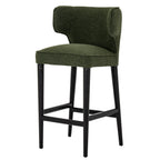 Three-quarter perspective view of the Avia Moss Barstool in green fabric with dark legs.