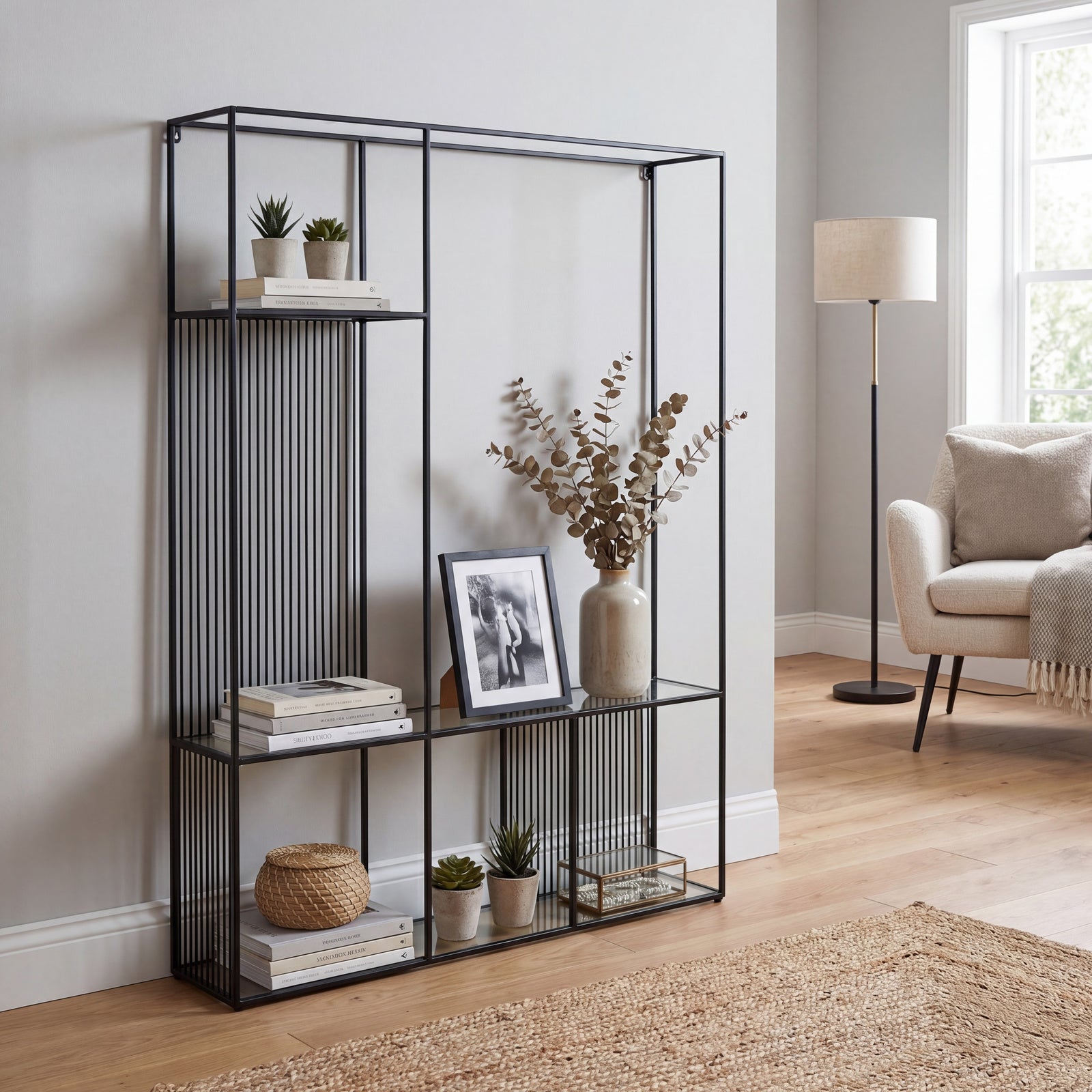 Front view of the Axis black metal geometric display shelf unit with clear glass shelves.