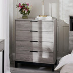 Bali grey oak effect 4 drawer chest styled in a bright modern bedroom next to flowers and books