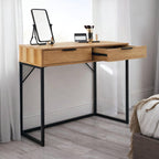 Bali natural oak effect 2 drawer dressing table desk styled with a table mirror and makeup brushes in a bright bedroom