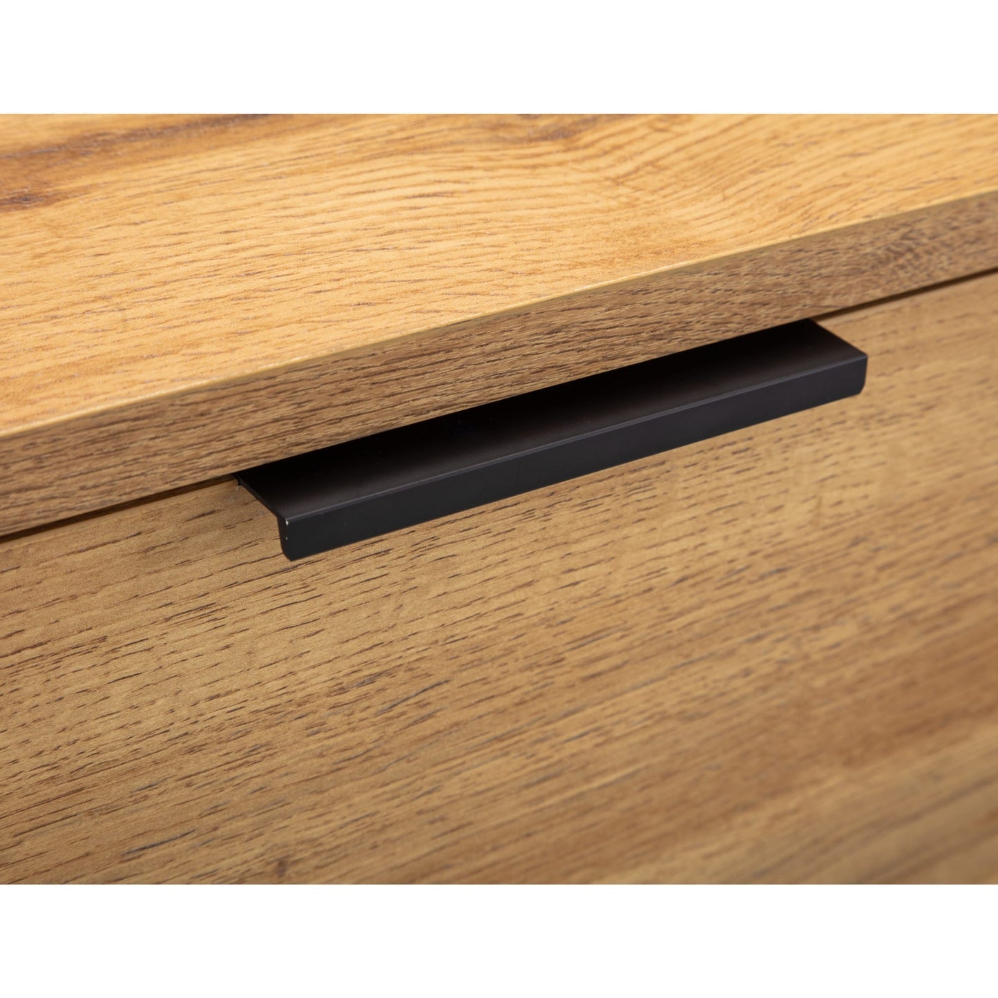 Close-up shot showing the natural oak wood effect texture and slim black metal lip drawer handle on the Bali chest