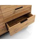 Close-up shot of a single extended pull-out drawer with black lip handle on the Bali oak chest