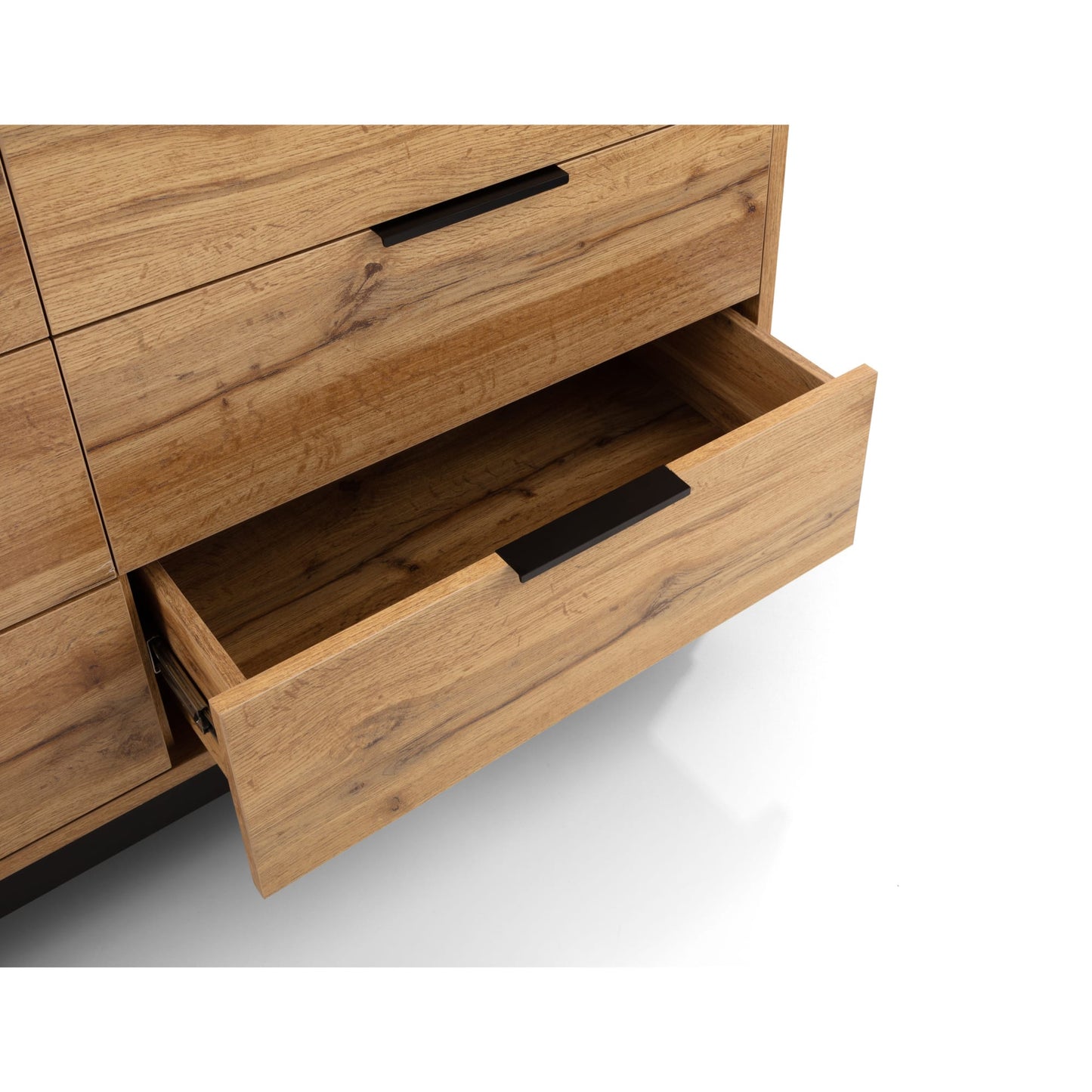 Close-up shot of a single extended pull-out drawer with black lip handle on the Bali oak chest