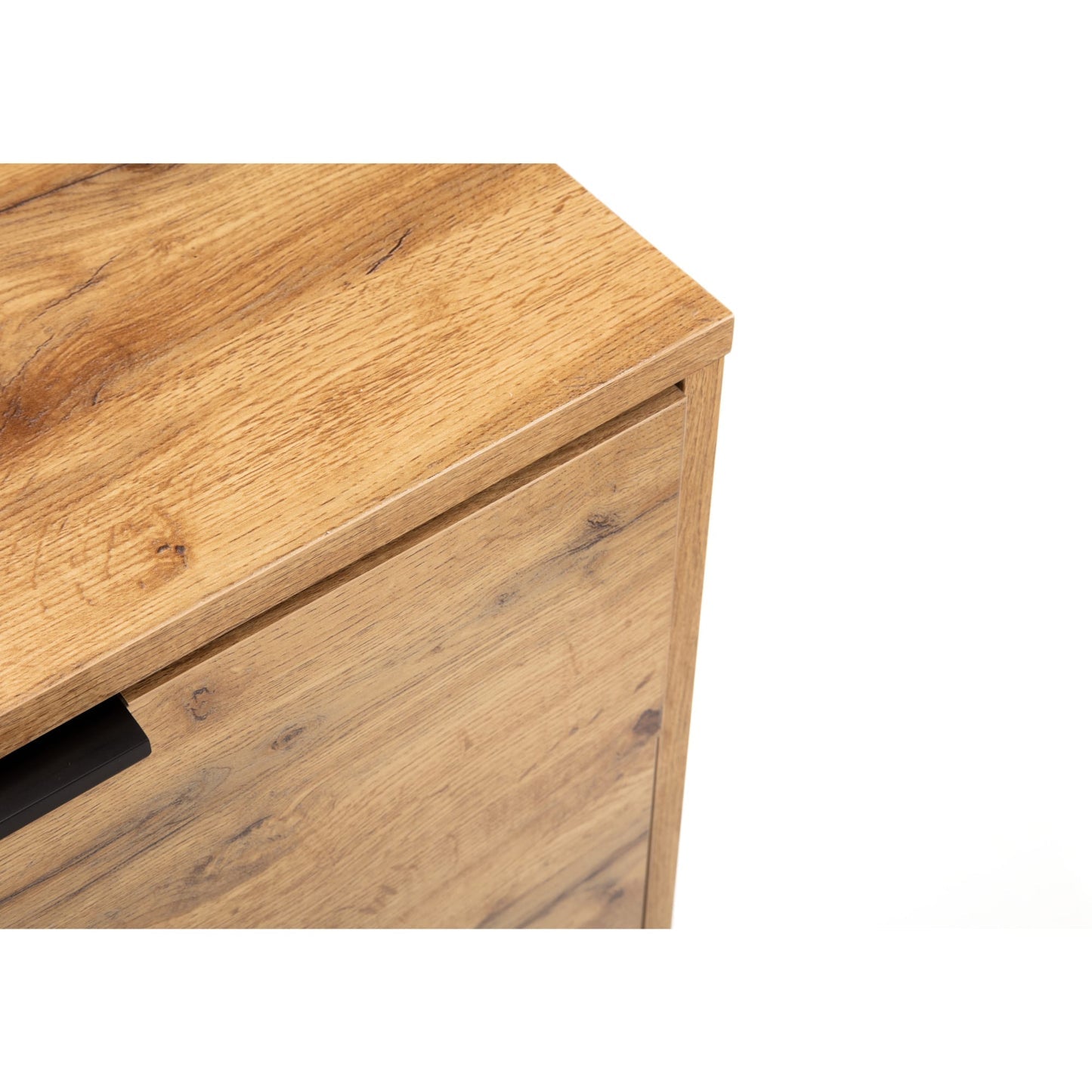 Detail shot of the natural oak wood effect finish and clean top corner profile of the Bali chest