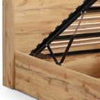 Detailed view of the metal gas-lift hydraulic hinge mechanism for the ottoman bed frame