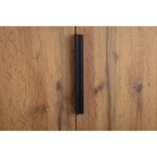 Detail shot of the long slim black metal door handles on the Bali natural oak wardrobe