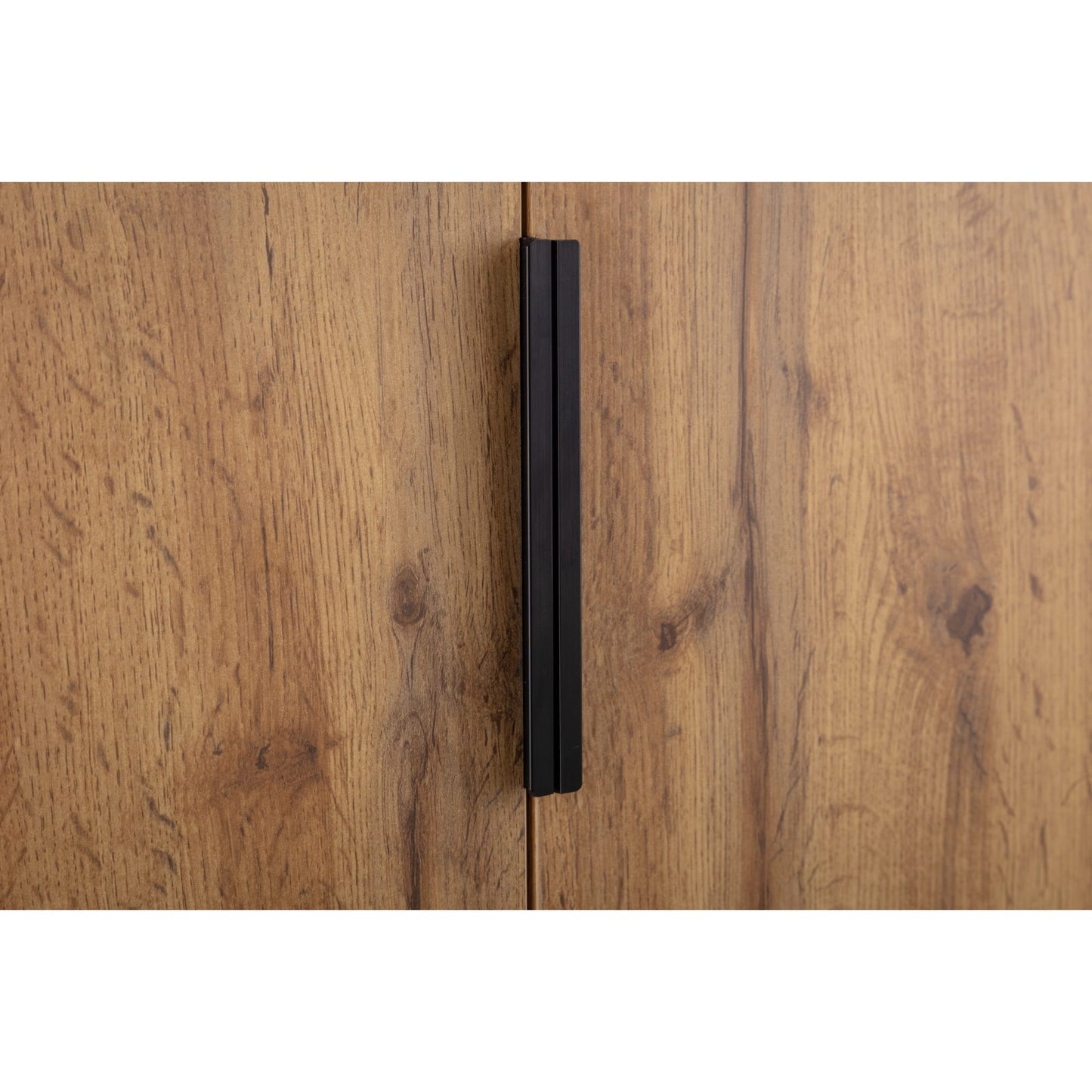 Detail shot of the long slim black metal door handles on the Bali natural oak wardrobe