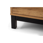 Close-up shot of the black metal underframe leg support on the Bali oak effect wardrobe